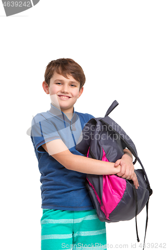 Image of Full length portrait of cute little kid in stylish clothes looking at camera and smiling
