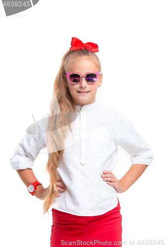 Image of Full length portrait of cute little kid in stylish jeans clothes looking at camera and smiling