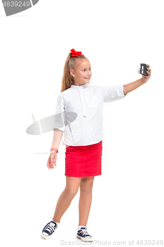 Image of Full length portrait of cute little kid in stylish clothes with retro camera
