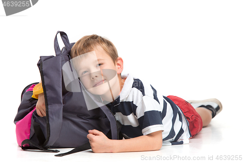 Image of Full length portrait of cute little kid in stylish clothes looking at camera and smiling