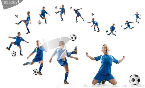 Image of Young boy with soccer ball doing flying kick