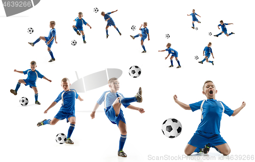 Image of Young boy with soccer ball doing flying kick