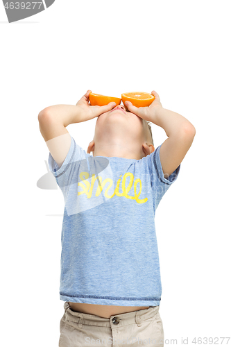 Image of Full length portrait of cute little kid in stylish clothes with orange