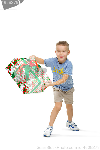 Image of Full length portrait of cute little kid in stylish clothes looking at camera and smiling