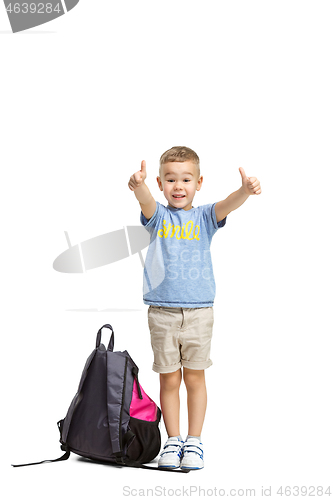 Image of Full length portrait of cute little kid in stylish clothes looking at camera and smiling