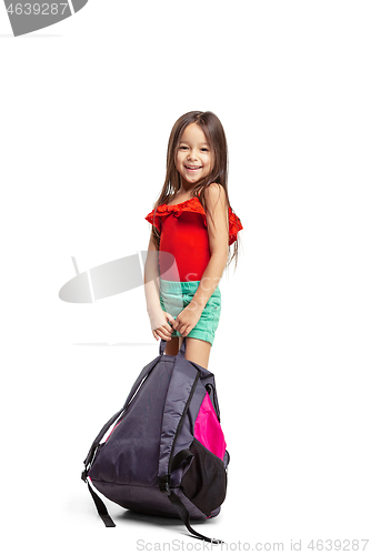 Image of Full length portrait of cute little kid in stylish jeans clothes looking at camera and smiling