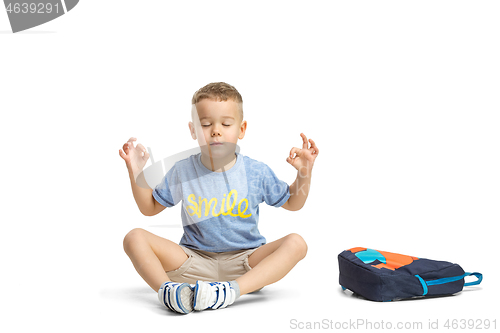 Image of Full length portrait of cute little kid in stylish clothes looking at camera and smiling