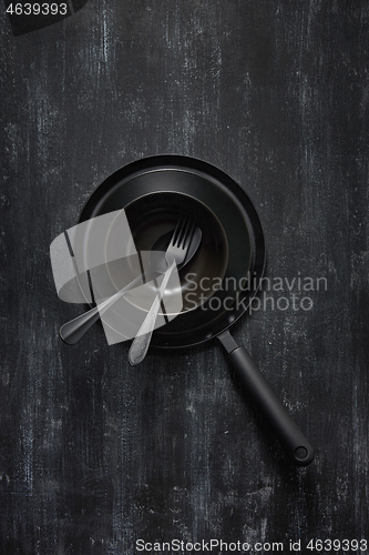 Image of Kitchen utensils collection black colored on the came color background.