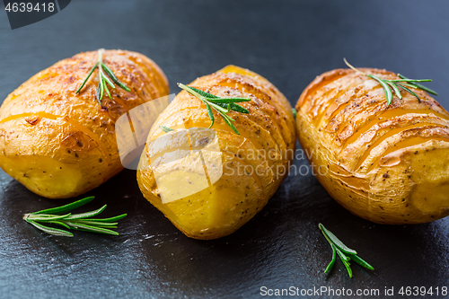 Image of Hasselback potatoes. Backed potatoes from Sweden with garlic and herbs