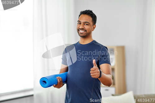 Image of indian man with fitness tracker showing thumbs up