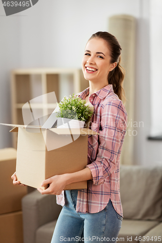 Image of happy woman with stuff moving to new home