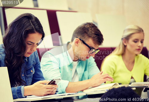 Image of group of students with smartphone at lecture