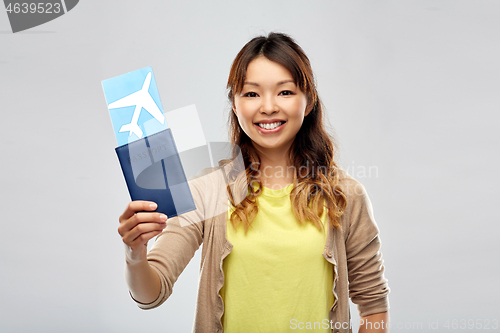 Image of african woman with passport and air ticket