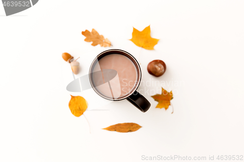 Image of hot chocolate, autumn leaves, acorns and chestnut