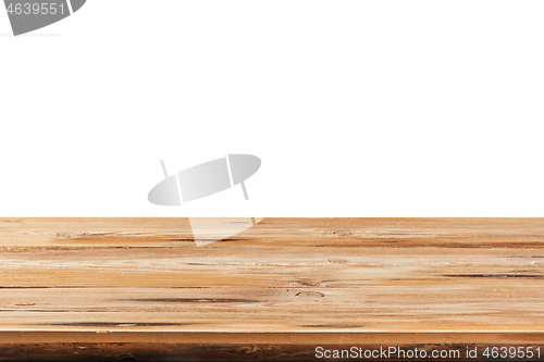 Image of Aged natural wooden table for montage or expose products on a white background.