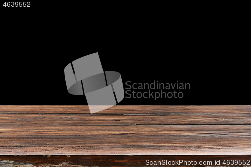 Image of Oaken table from wooden planks on a black background for display or present your products.