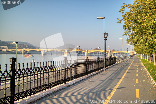 Image of Sidewalk along Danube river with view to Margaret Bridge, Budapest.