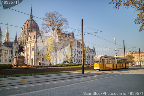 Image of Square before Hungarian paliament building with moving tram in Budapest.