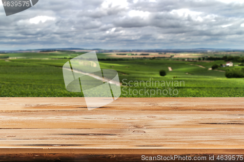 Image of Retro wooden table on a natural countryside background for display or montage your products.