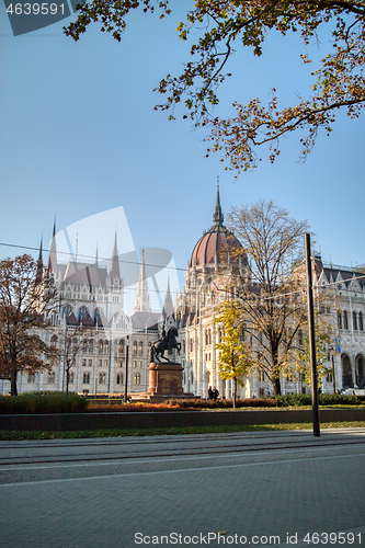 Image of Rakoczi Ferenc equestrian statue on the background of Hungarian paliament building.