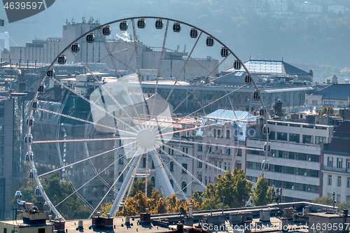 Image of Budapest Eye, ferris wheel attraction on city background in Budapest.