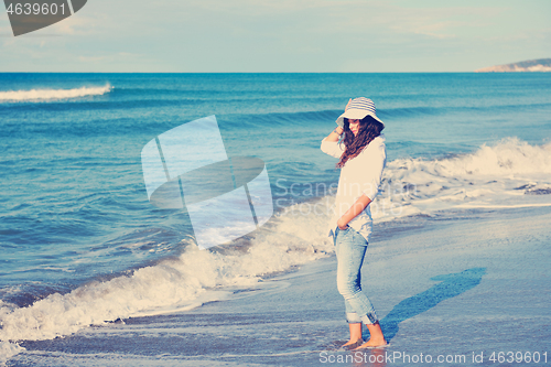 Image of happy young woman on beach