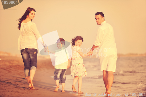 Image of happy young family have fun on beach