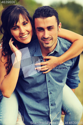 Image of happy young couple have romantic time outdoor