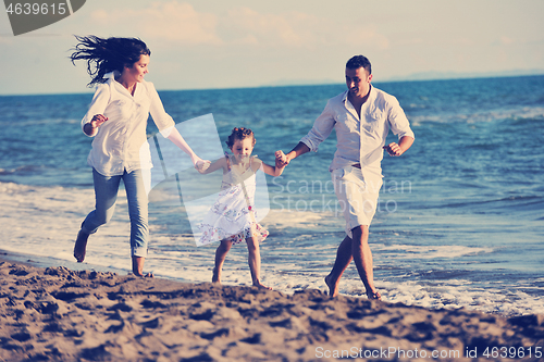 Image of happy young  family have fun on beach