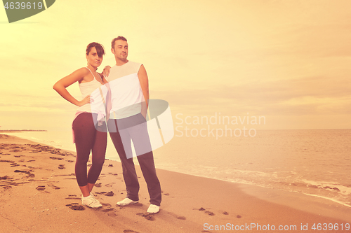 Image of happy young couple have fun at beautiful beach