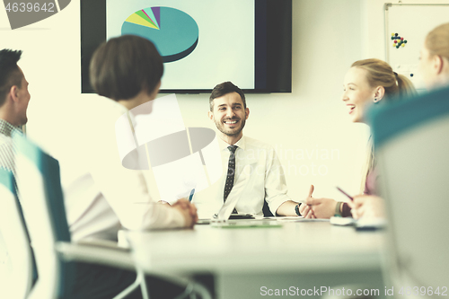 Image of young business people group on team meeting at modern office