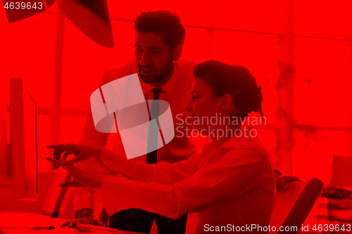 Image of business couple working together on project