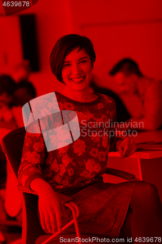 Image of portrait of young business woman at office with team on meeting 