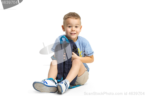 Image of Full length portrait of cute little kid in stylish clothes looking at camera and smiling