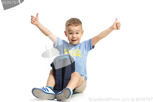 Image of Full length portrait of cute little kid in stylish clothes looking at camera and smiling