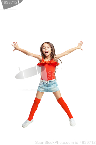 Image of Cute little girl jump. Studio shot. White background