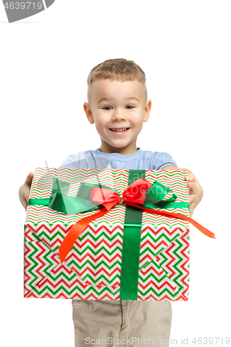 Image of Full length portrait of cute little kid in stylish clothes looking at camera and smiling
