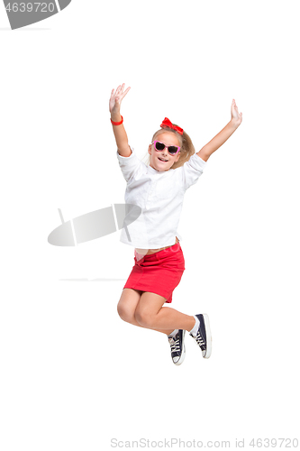 Image of Cute little girl jump. Studio shot. White background