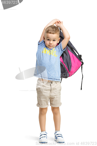Image of Full length portrait of cute little kid in stylish clothes looking at camera and smiling