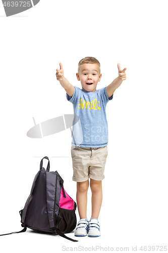 Image of Full length portrait of cute little kid in stylish clothes looking at camera and smiling