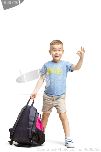 Image of Full length portrait of cute little kid in stylish clothes looking at camera and smiling