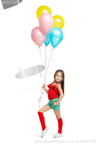 Image of Full length portrait of cute little kid in stylish jeans clothes looking at camera and smiling