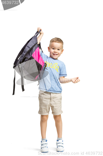 Image of Full length portrait of cute little kid in stylish clothes looking at camera and smiling