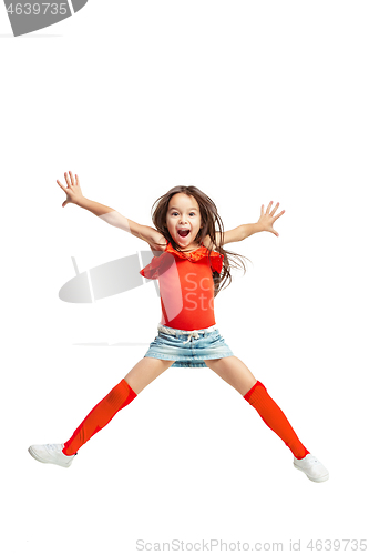 Image of Cute little girl jump. Studio shot. White background