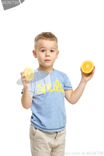 Image of Full length portrait of cute little kid in stylish clothes with orange