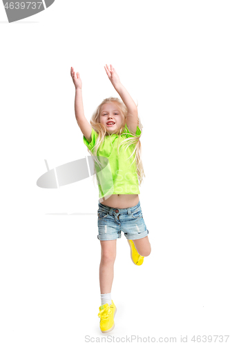 Image of Cute little girl jump. Studio shot. White background