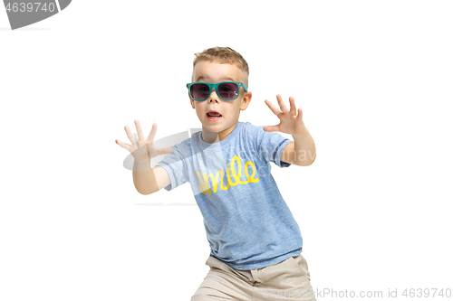 Image of Full length portrait of cute little kid in stylish clothes looking at camera and smiling