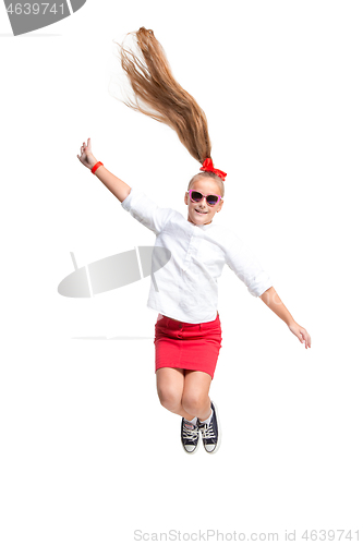 Image of Cute little girl jump. Studio shot. White background