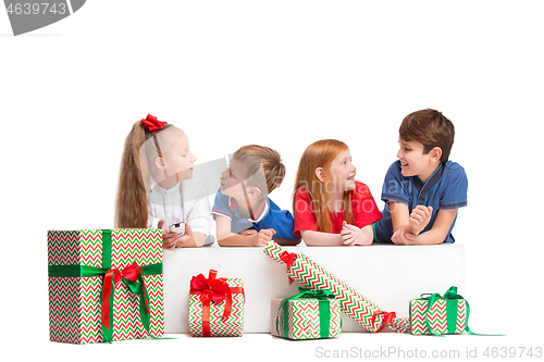 Image of Full length portrait of cute little kids in stylish clothes looking at camera and smiling