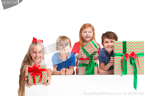 Image of Full length portrait of cute little kids in stylish clothes looking at camera and smiling